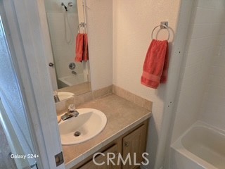 195 Tierra Rejada Road, Unit 29 Simi Valley, CA 93065 - Photo 29 of 33 a bathroom with a sink vanity and tub