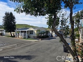 195 Tierra Rejada Road, Unit 29 Simi Valley, CA 93065 - Photo 4 of 33 a front view of a house with a garden