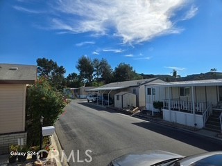 195 Tierra Rejada Road, Unit 29 Simi Valley, CA 93065 - Photo 5 of 33 a view of a patio with table and chairs with wooden fence