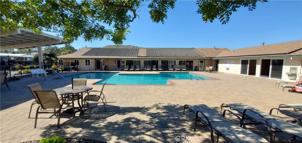 195 Tierra Rejada Road, Unit 29 Simi Valley, CA 93065 - Photo 10 of 33 a patio with a table and chairs and potted plants