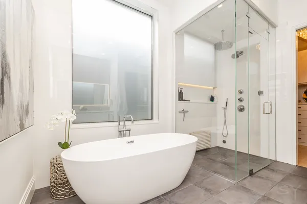 a bathroom with a bathtub and shower