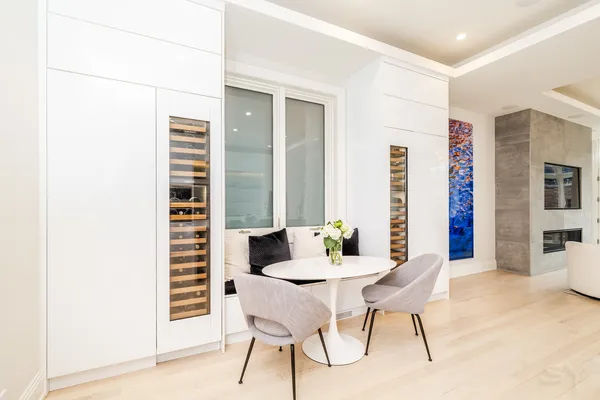 a dining room with furniture and window