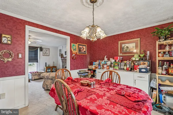 a bedroom with a bed and chandelier