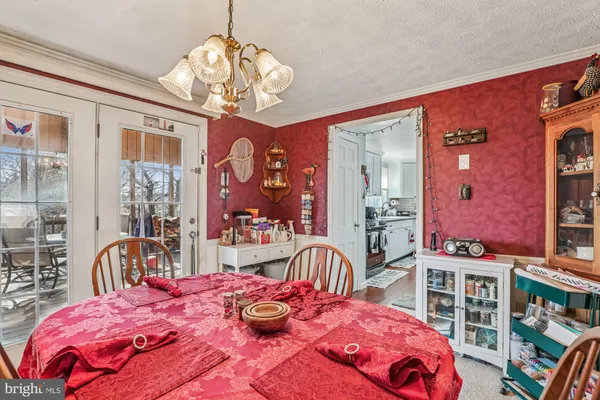 a bedroom with furniture and a chandelier