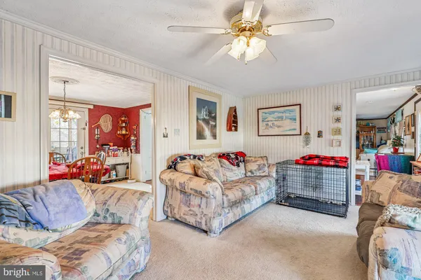 a view of room with window and ceiling fan