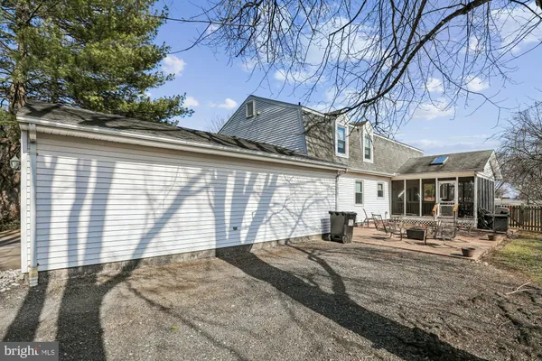 a view of a house with a yard and the trees