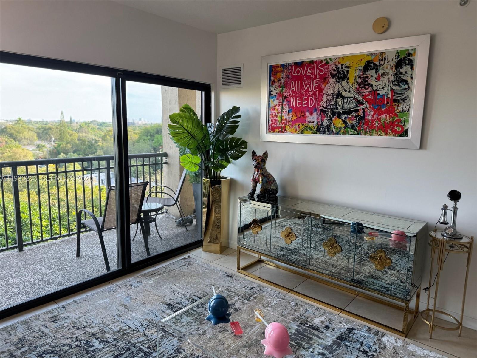 3530 Southwest 22nd Street, Unit 706 Miami, FL 33145 - Photo 4 of 18 a living room with furniture