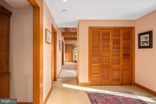 a view of walk in closet with clothes