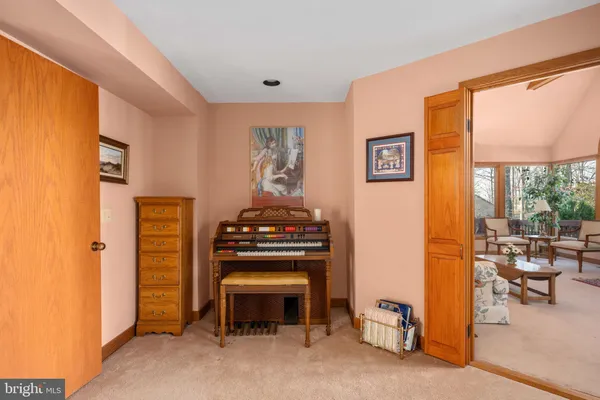 a view of a living room with furniture and wooden floor