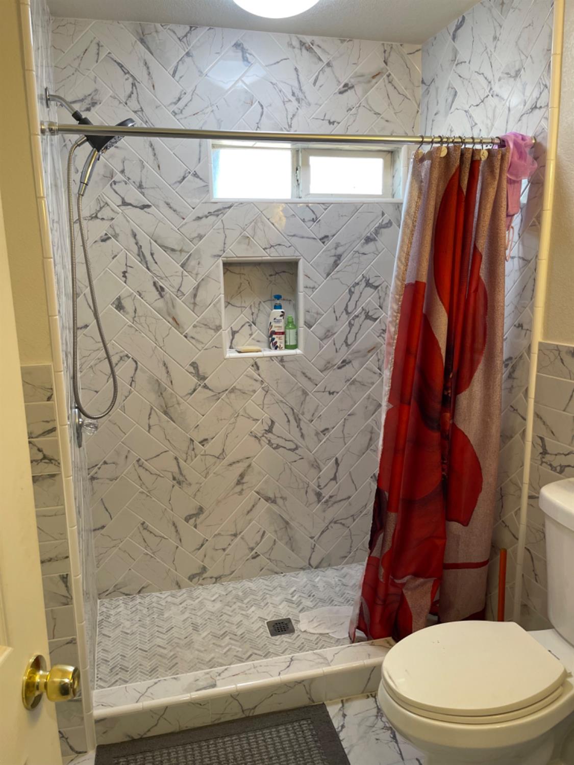 2805 Wright Street Selma, CA 93662 - Photo 23 of 26 a bathroom with a toilet and a shower