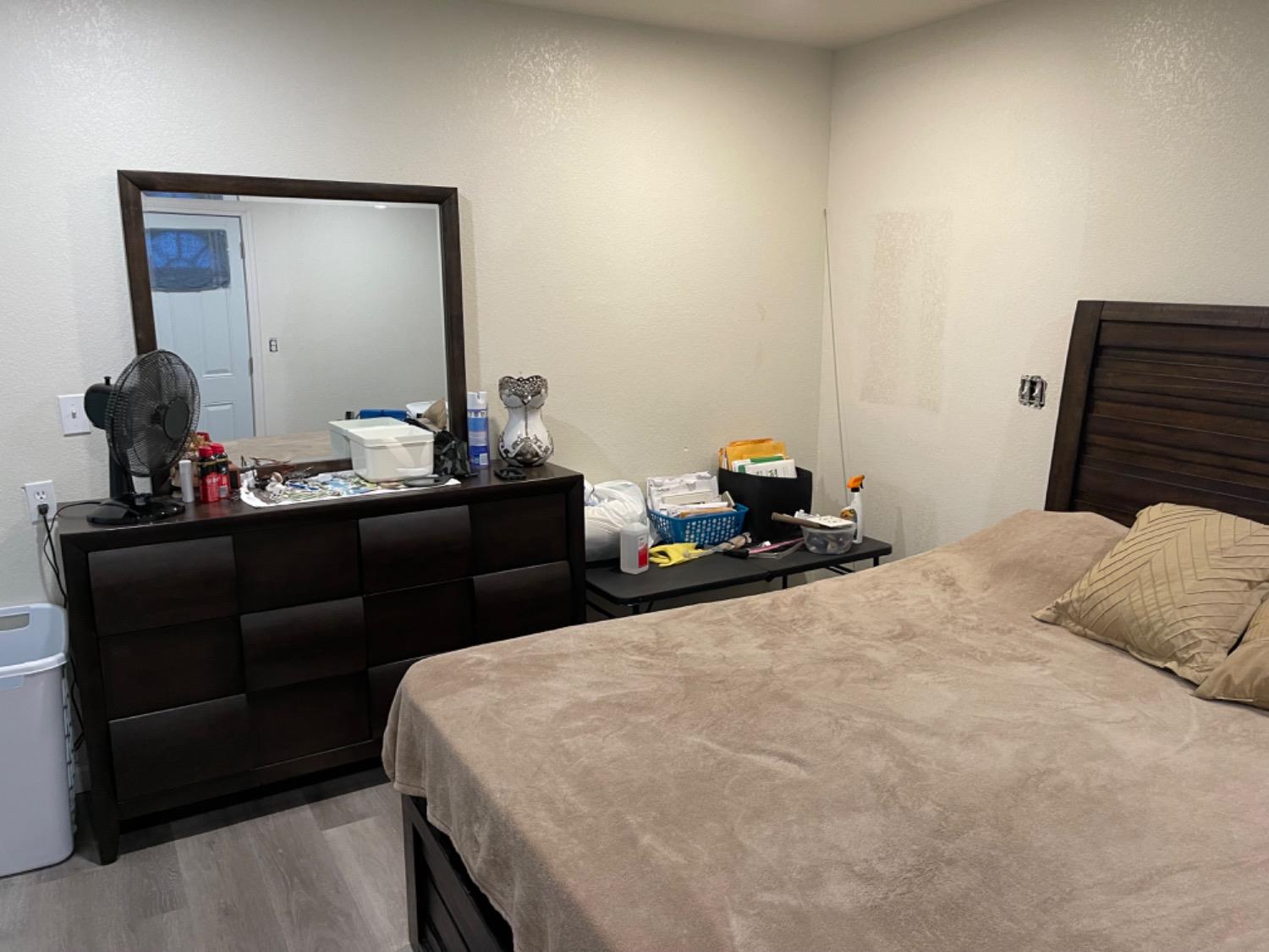 2805 Wright Street Selma, CA 93662 - Photo 10 of 26 a bedroom with a bed and a mirror