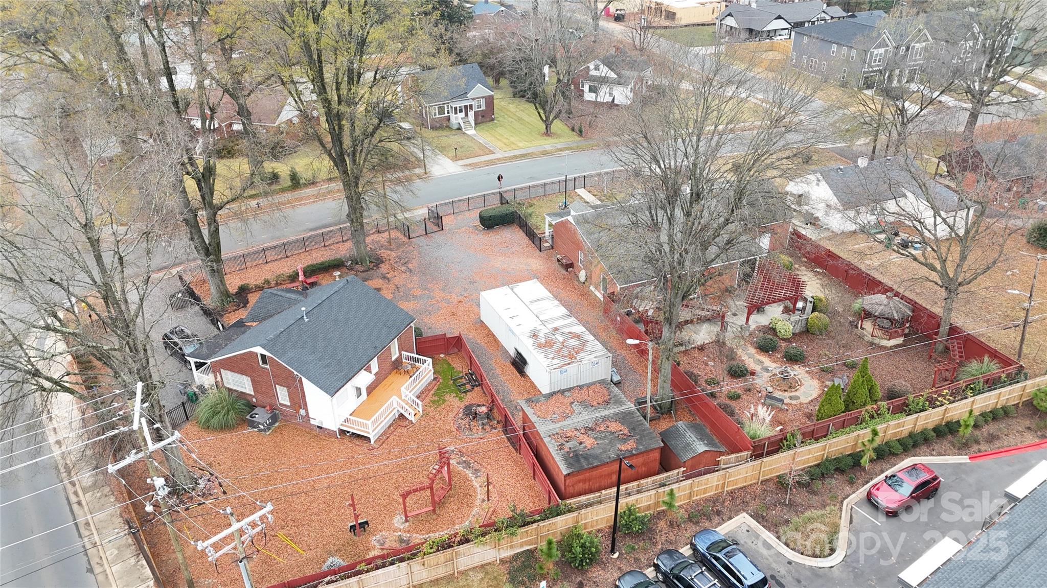 400 Bowman Road, Unit 1 Charlotte, NC 28217 - Photo 14 of 16 an aerial view of a house with a yard and outdoor seating