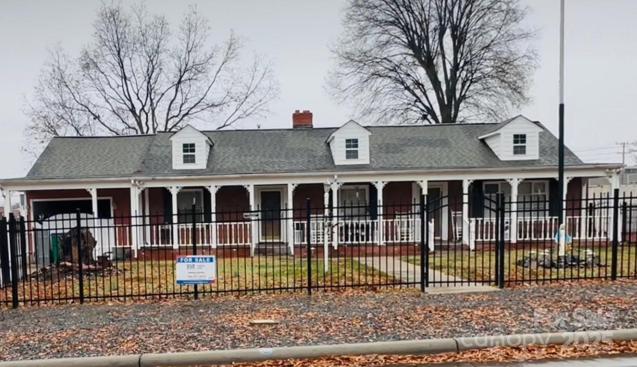 400 Bowman Road, Unit 1 Charlotte, NC 28217 - Photo 2 of 16 a view of a brick house with a large window