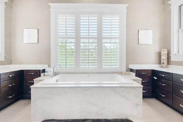 a bathroom with a bathtub and a sink