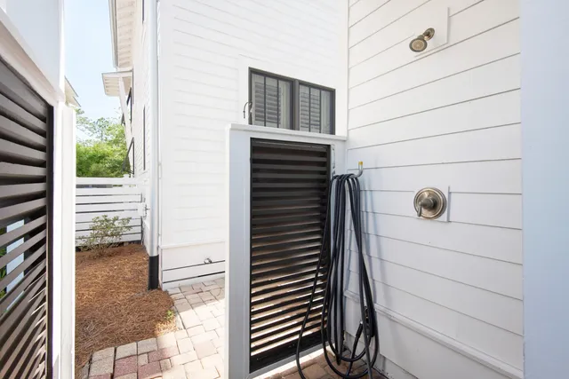 a view of a door and chair in the balcony
