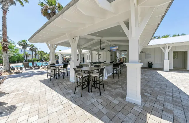 a view of a dining hall with many windows
