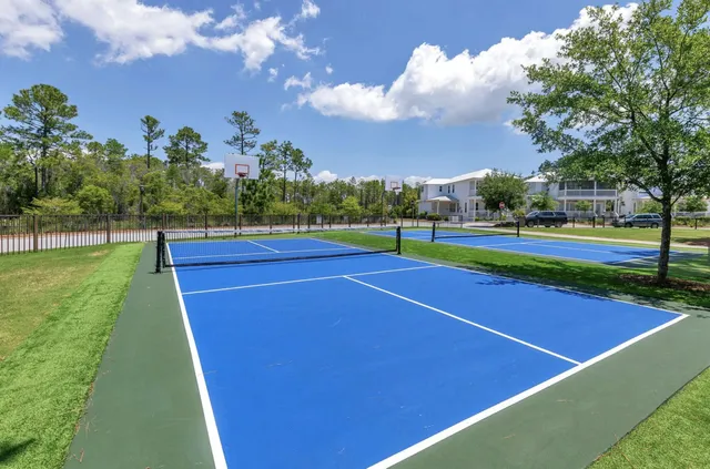a view of an outdoor space and tennis court