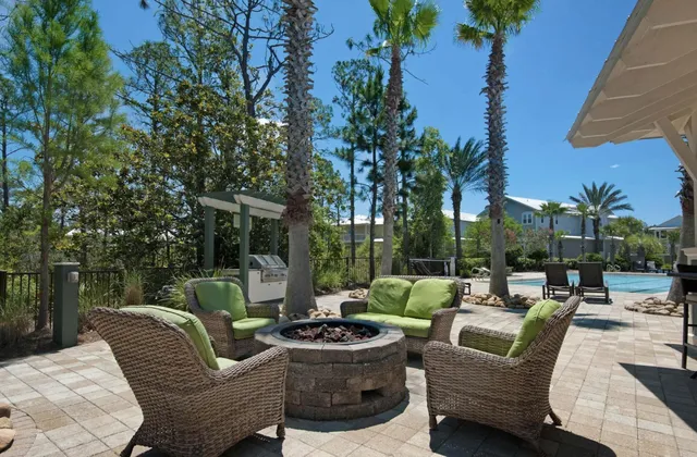 a view of a patio with couches and a fire pit