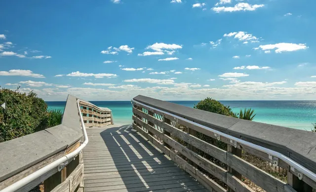 a view of a balcony with wooden floor