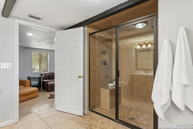 a bathroom with a shower and a toilet