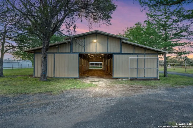 a view of a house with a yard and garage