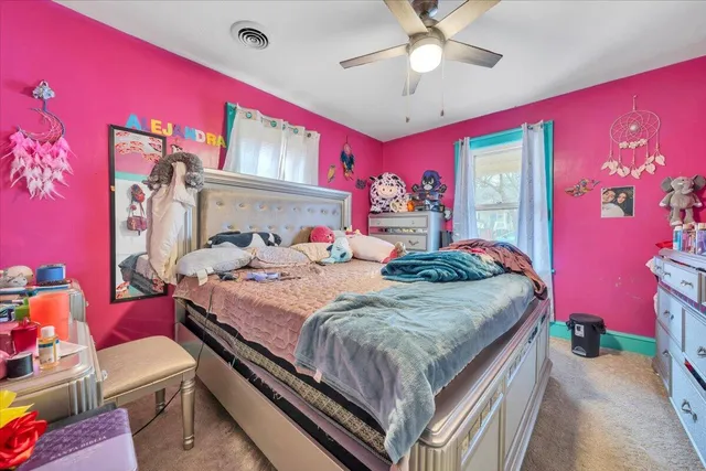 a bed room with a bed and a couch