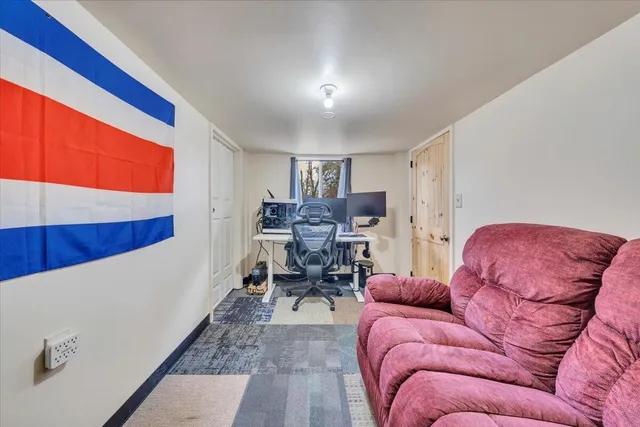 a bathroom with a toilet and a shower curtain
