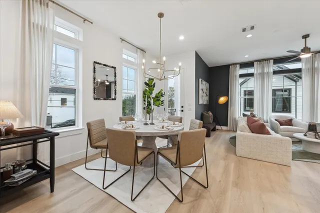 a view of a dining room with furniture window and wooden floor