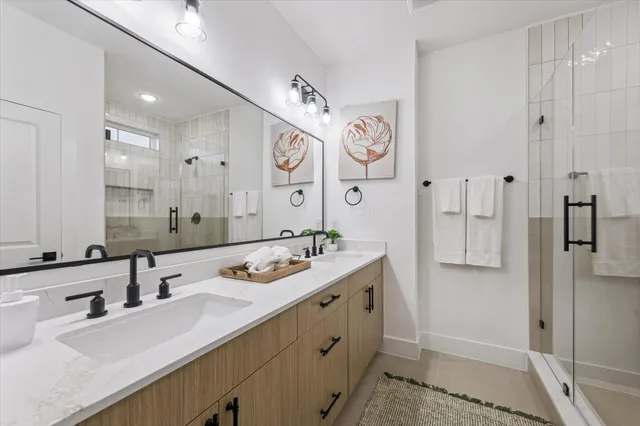 a bathroom with a sink vanity and a mirror