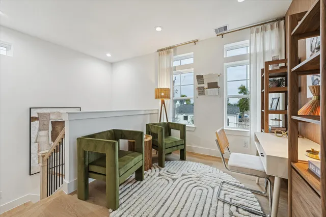 a bedroom with furniture and a book shelf