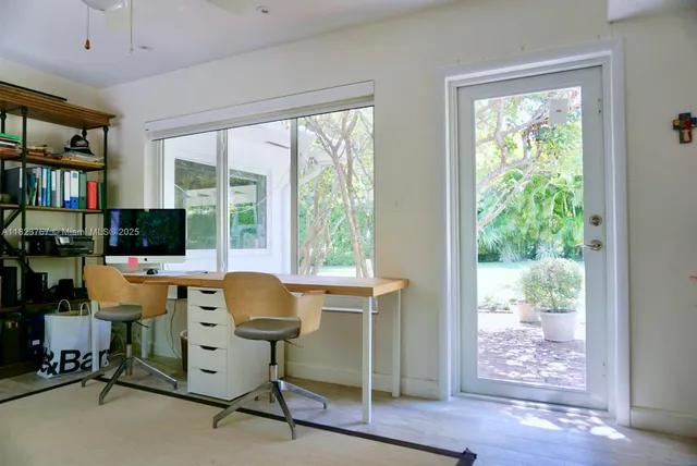 a workspace with furniture and a window