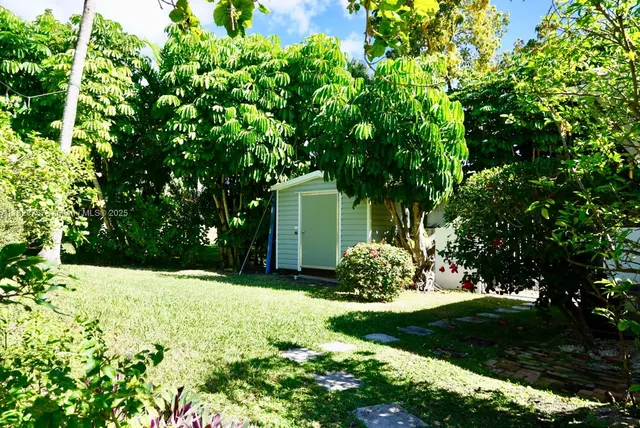 a backyard of a house with lots of green space