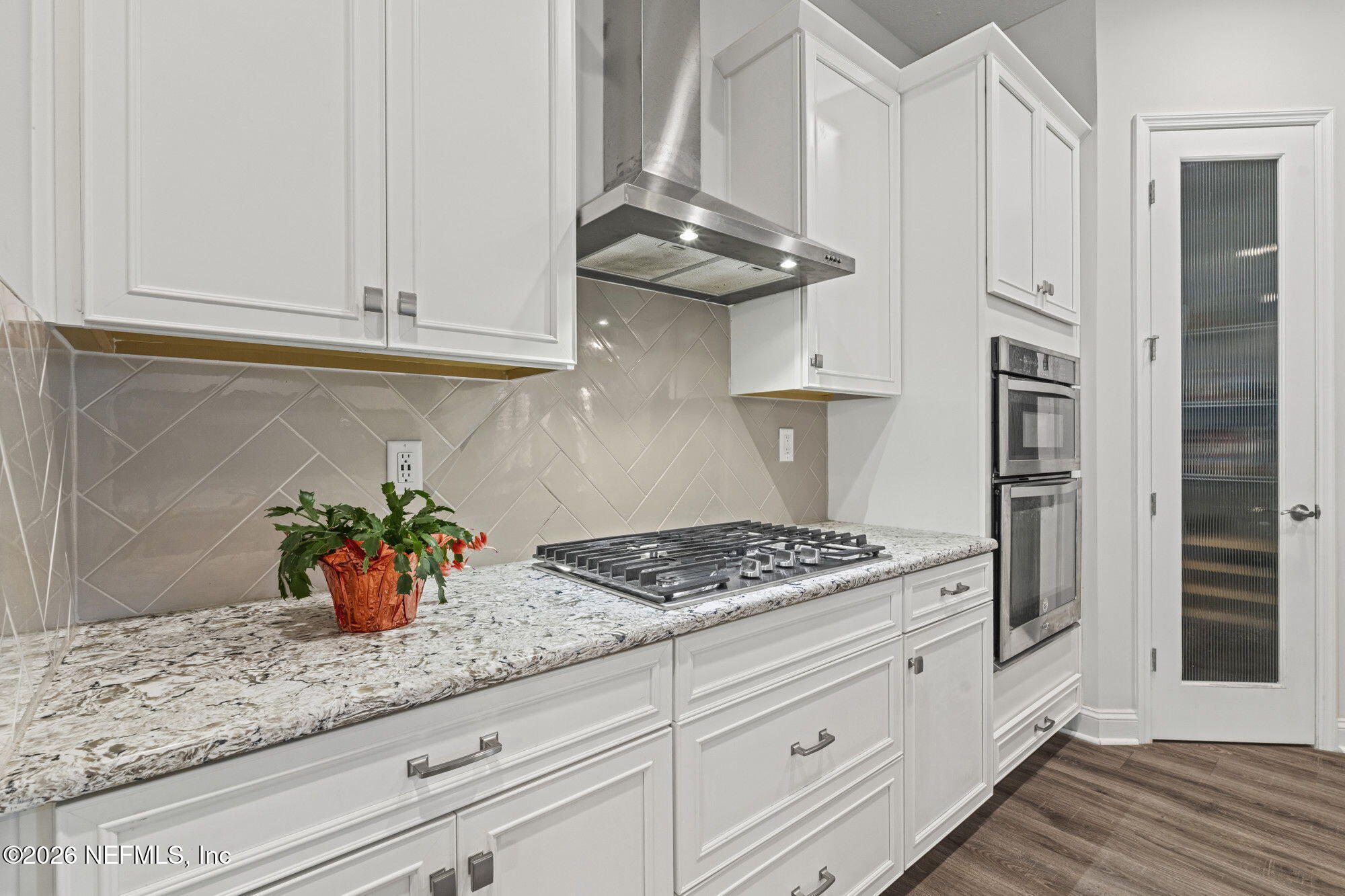 87 Footbridge Road St. Johns, FL 32259 - Photo 9 of 32 a kitchen with stainless steel appliances granite countertop a sink a stove and cabinets