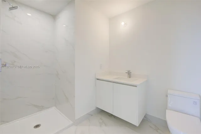 a bathroom with a sink toilet and bathtub