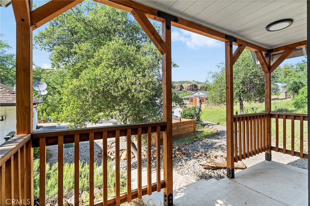2262 Honey Run Road Chico, CA 95928 - Photo 35 of 74 a view of a porch with a floor to ceiling window