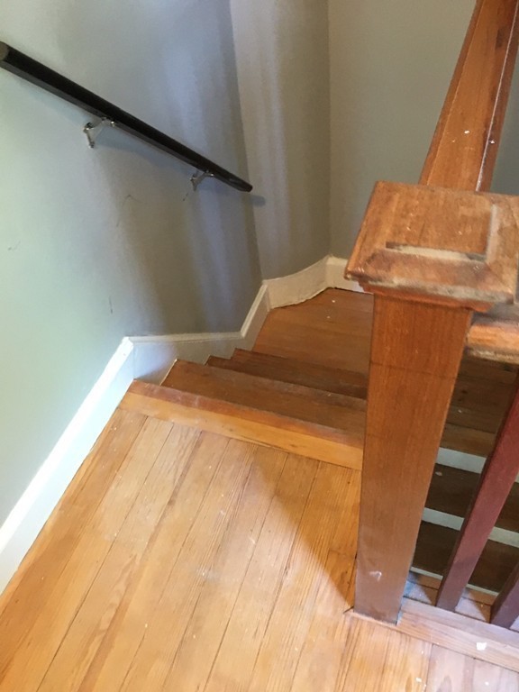 5 Mountfair Terrace Boston, MA 02136 - Photo 12 of 15 a bedroom with a bed and wooden floor