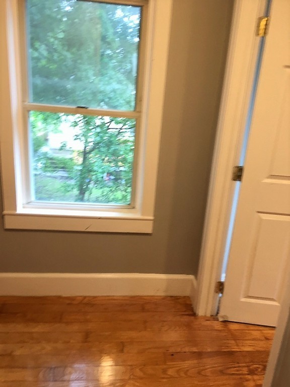 5 Mountfair Terrace Boston, MA 02136 - Photo 13 of 15 a view of a room with wooden floor and a window