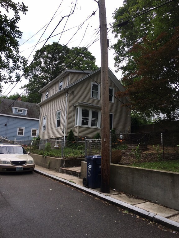 5 Mountfair Terrace Boston, MA 02136 - Photo 8 of 15 a car parked in front of a white house