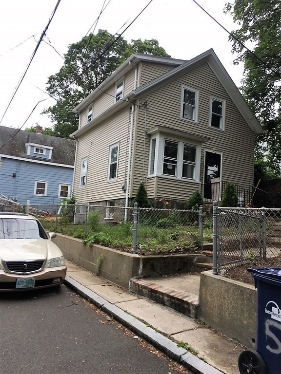 5 Mountfair Terrace Boston, MA 02136 - Photo 9 of 15 a car parked in front of a white house