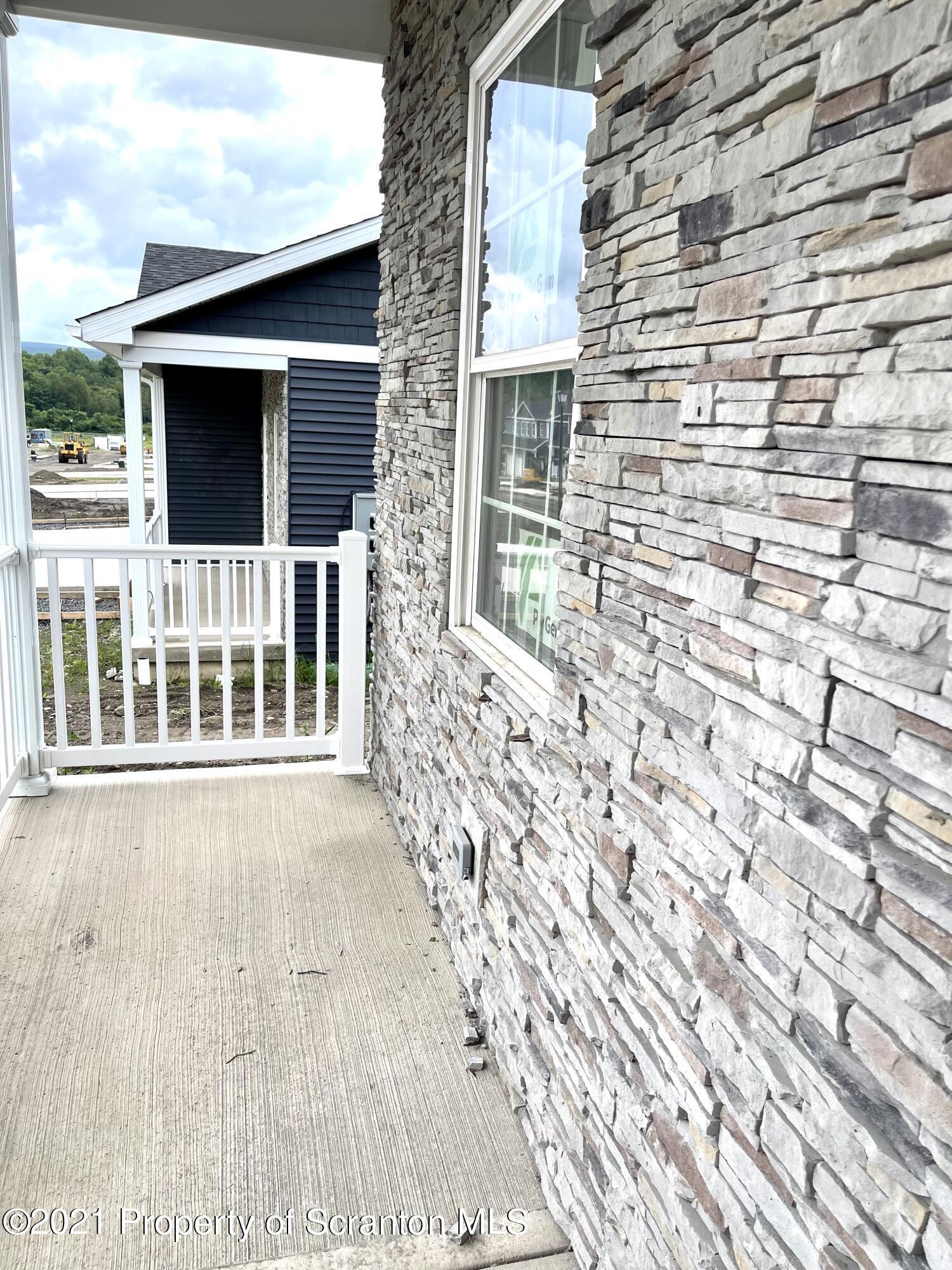 429 Felts Street Taylor, PA 18517 - Photo 5 of 13 a view of front door of house with wooden floor