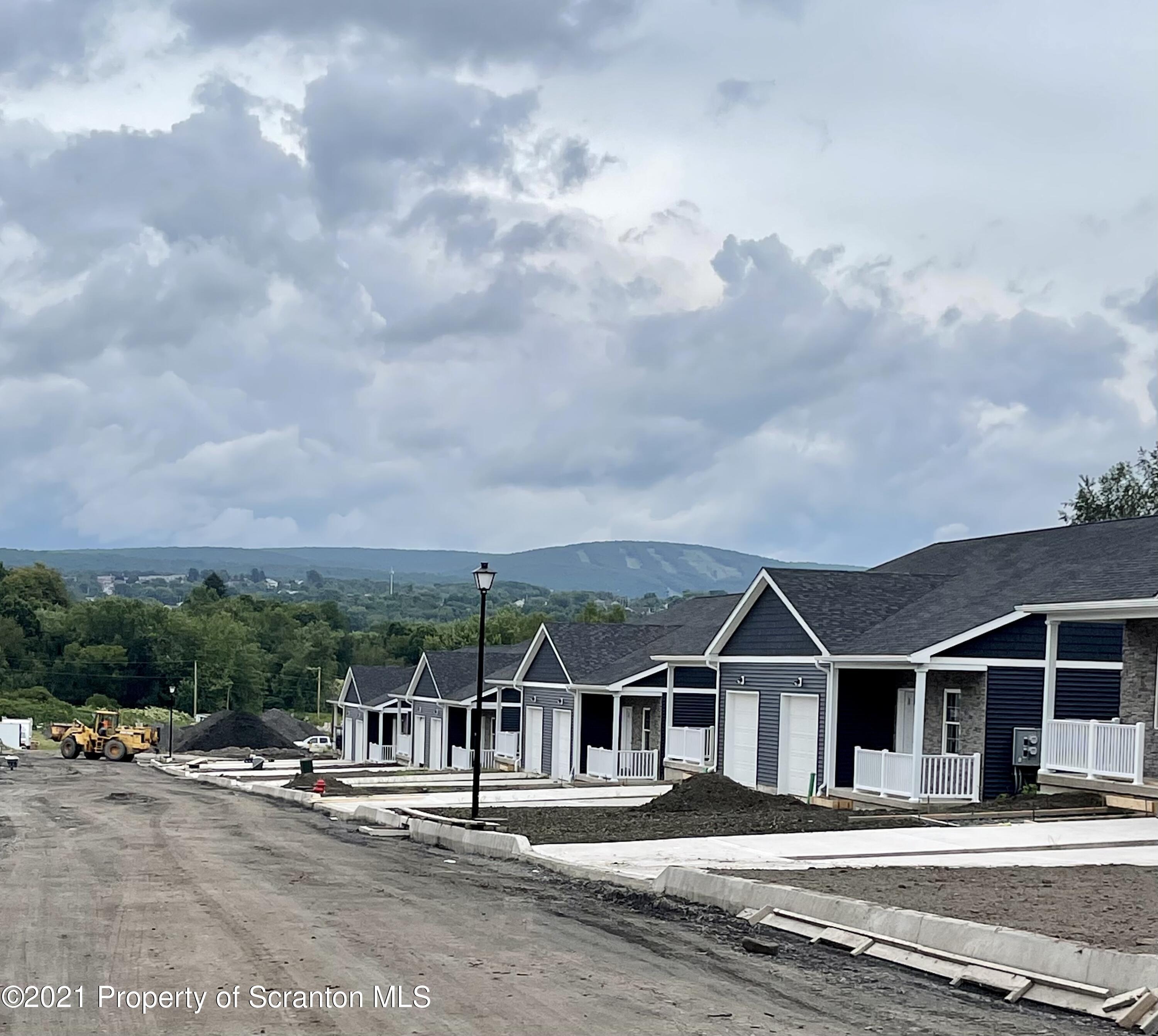 429 Felts Street Taylor, PA 18517 - Photo 7 of 13 a front view of a house with a garden