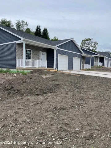 a front view of a house with yard