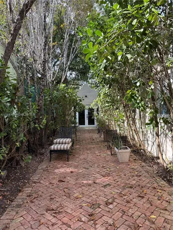 a view of a couches in backyard of the house