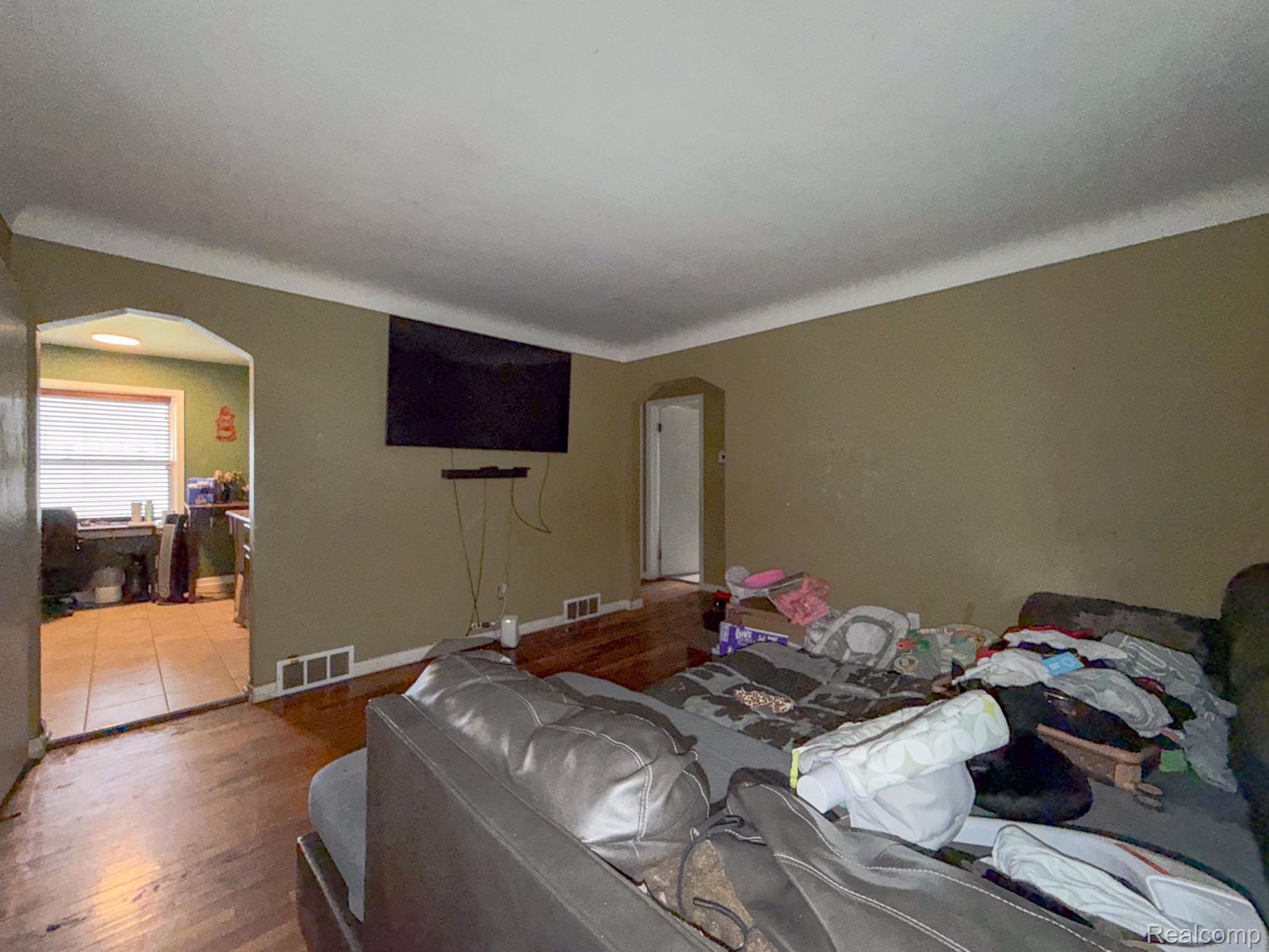 24811 Valley Avenue Eastpointe, MI 48021 - Photo 11 of 22 Bedroom featuring arched walkways and wood finished floors