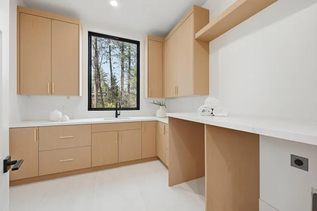 a bedroom with furniture and a wooden floor