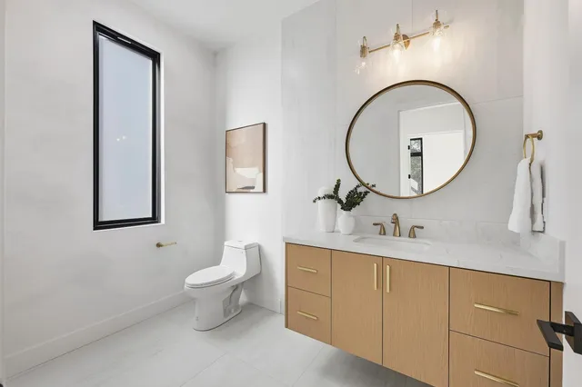 a bathroom with a bathtub sink and toilet