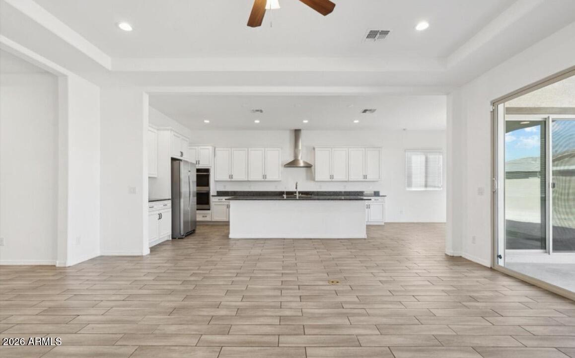 15718 West Adams Street Goodyear, AZ 85338 - Photo 2 of 6 a view of kitchen with wooden floor