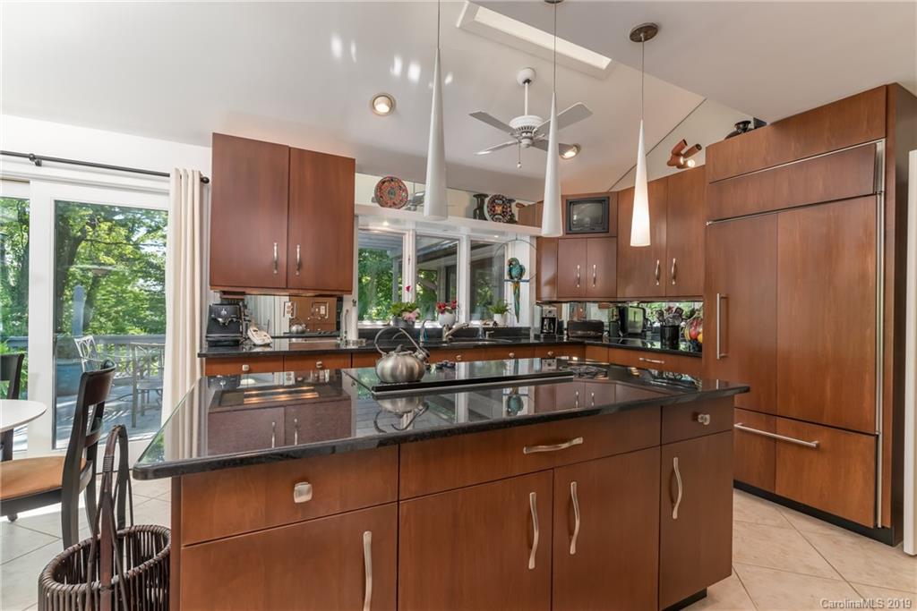 320 Ridgetop Road Tryon, NC 28782 - Photo 11 of 36 a kitchen with stainless steel appliances granite countertop a refrigerator and a sink
