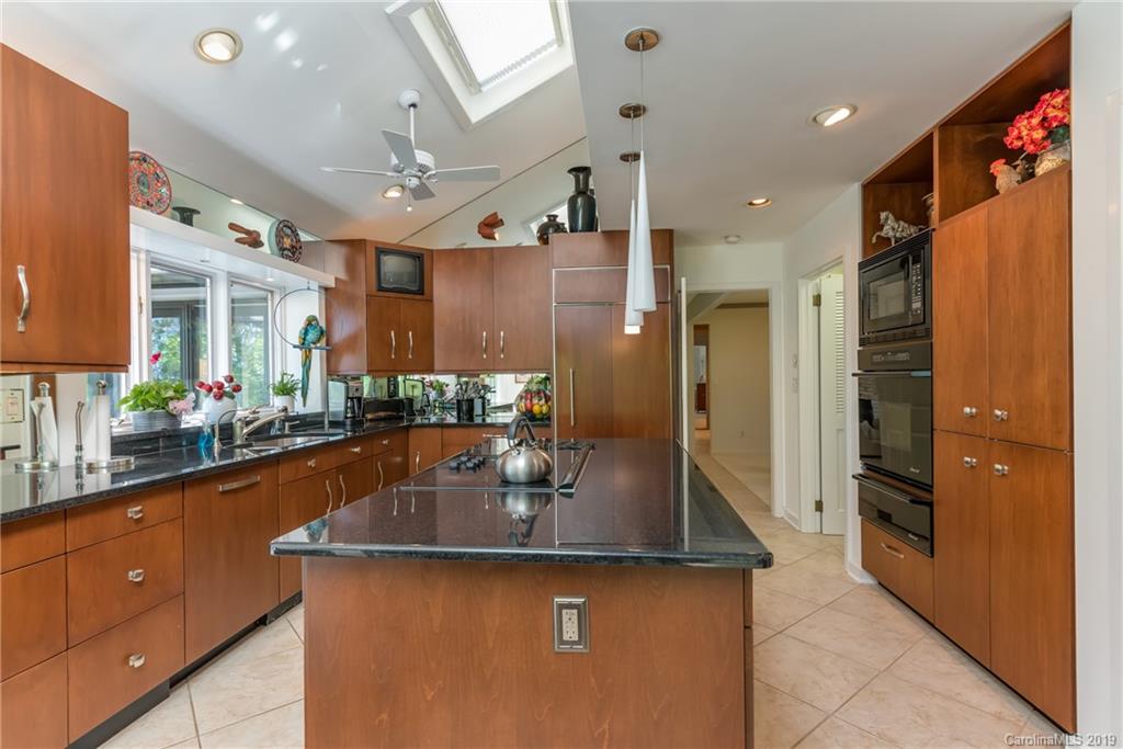 320 Ridgetop Road Tryon, NC 28782 - Photo 12 of 36 a kitchen with stainless steel appliances granite countertop a sink a refrigerator and a refrigerator