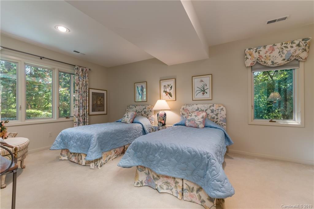 320 Ridgetop Road Tryon, NC 28782 - Photo 25 of 36 a bedroom with two beds and a large window